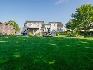 Back View of the house & yard. Large yard perfect for lots of outdoor fun!