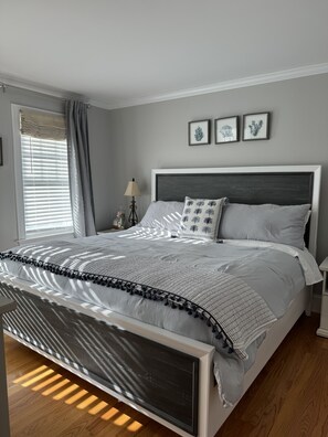 Calming neutrals greet you in the spacious downstairs king guest room