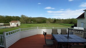 View of the backyard in summertime. Lots of space and a gorgeous view!