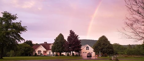 Berkshire Mountain Guesthouse under a rainbow.