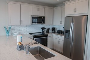 Curb your appetite by cooking a meal in your kitchen.
