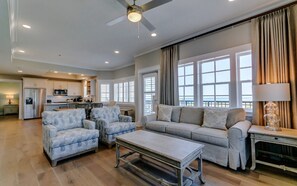 Find peace and relaxation with your close friends and family in this stunning living room featuring natural decor.