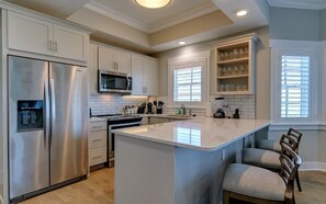 The fully-equipped kitchen features all the amenities you'd need to make a delicious meal.