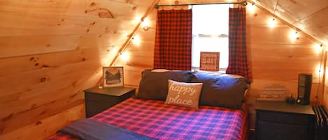 Loft bedroom with queen bed