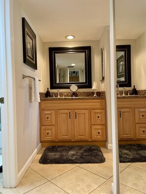 Vanity area located outside of full bathroom