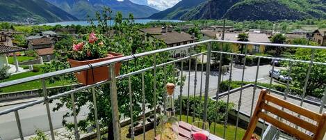 Cloud, Mountain, Sky, Plant, Property, Building, Flowerpot, Fence, Natural Landscape, Table