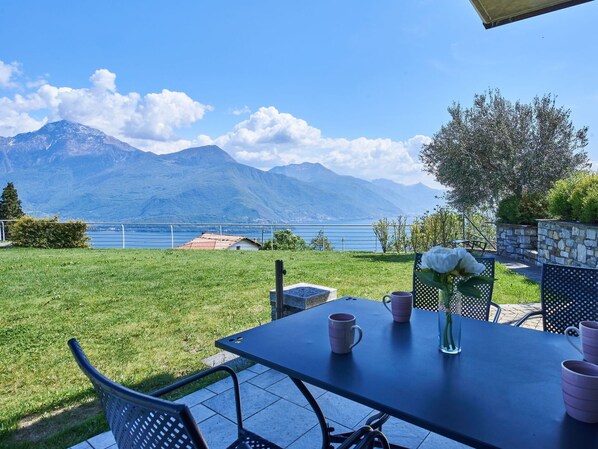 Sky, Furniture, Plant, Table, Property, Cloud, Blue, Tableware, Mountain, Chair