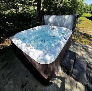 Relaxing sun dappled hot tub