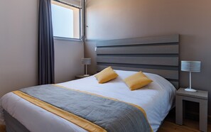 The 2 bedrooms feature a variety of bedding options.