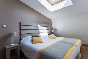 The second bedroom contains 2 Single beds.