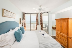 Main bedroom with ocean view and private balcony access