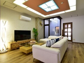 There is a large sofa in the living room.