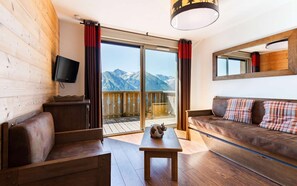 The living room features a pullout sofabed to sleep extra guests.