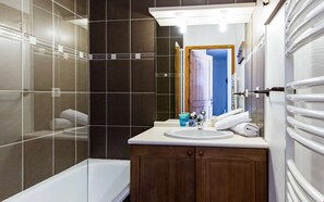 Get ready for the day in the bright bathroom.