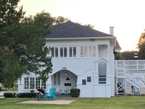 Casa de Flora showing front patio with adirondack chairs