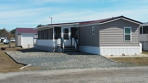 Plenty of parking space and entry to front porch from driveway.