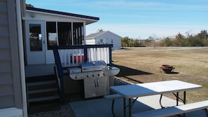 Large gas grill, Picnic table and Firepit.  Large yard  (NO VEHICLES ETC. ON IT)