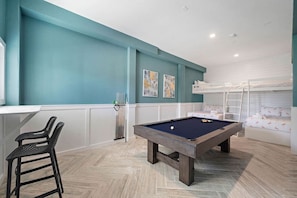 Enjoy this game room with a variety of games