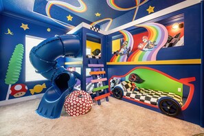 This fun filled kids room includes 2 twin beds and 4 fulls.