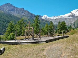 Sky, Mountain, Ecoregion, Plant, Natural Landscape, Tree, Highland, Land Lot, Grass, Mountainous Landforms