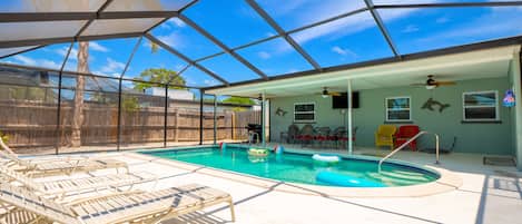 Beautiful enclosed pool with great Florida lanai. Table, chairs, 55" Smart TV