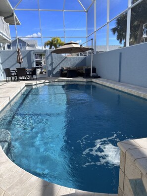 Covered seating to relax and eat by the pool.