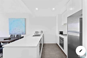 Oven,fridge,washing machine in the kitchen
