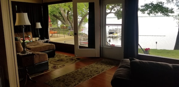 Living room with two 10' windows facing Big Birch Lake 