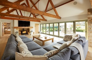 Living room off the open plan kitchen / dining area.