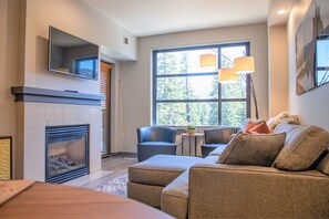 Large windows and glass patio door fill the home with light.