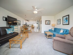 Families love the spacious living room with two couches which fold out as beds.