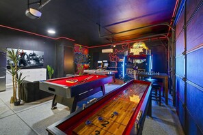 The gameroom has HAS TO be seen in person to appreciate the detail. It has a Jurassic Park virtual game, rertro video games, shuffleboard, air hockey, pool table, chess, poker, glow in the dark basketball & huge TV lounge area w fridge
