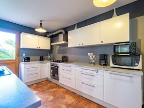 Countertop, Cabinetry, Furniture, Kitchen Stove, Drawer, Tap, Blue, Kitchen Appliance, Building, Kitchen