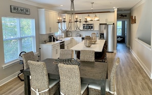 Fully stocked kitchen with large island -6 barstools. Dining table seats 6.