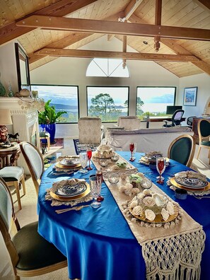 Grand living room with custom tablescape for wedding anniversary.