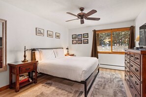 A comfortable king bed, flat screen TV and en-suite bath are found in the master bedroom of this vacation rental.