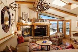 True Colorado lodge feel in this Shadowbrook top floor condo with incredible views of the ski area and valley.