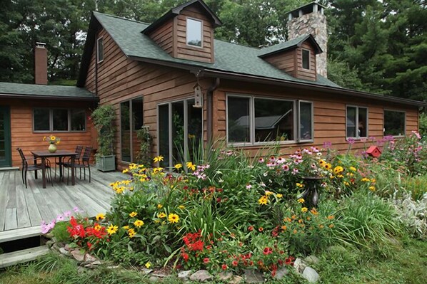 Secluded and charming cedar home on 5 gorgeous acres with fruit trees!