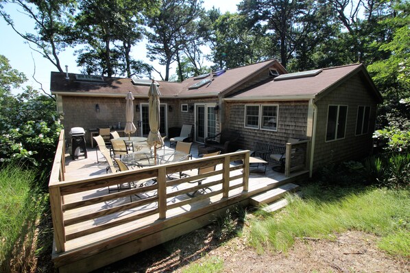 Large deck with gas grill and outdoor furniture