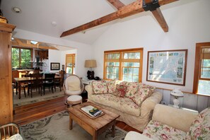 Living room has comfortable seating and TV