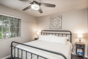 Master bedroom with a very comfortable king-sized bed. Attached full bathroom (not shown here) and walk-in closet.