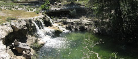 The grotto is visible from the cabin. Flow will vary depending on rainfall