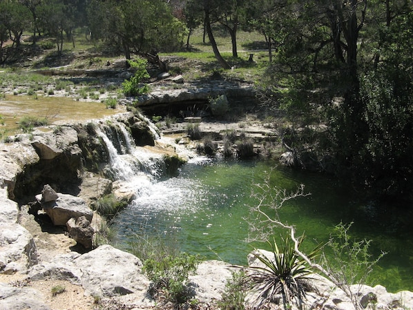 The grotto is visible from the cabin. Flow will vary depending on rainfall