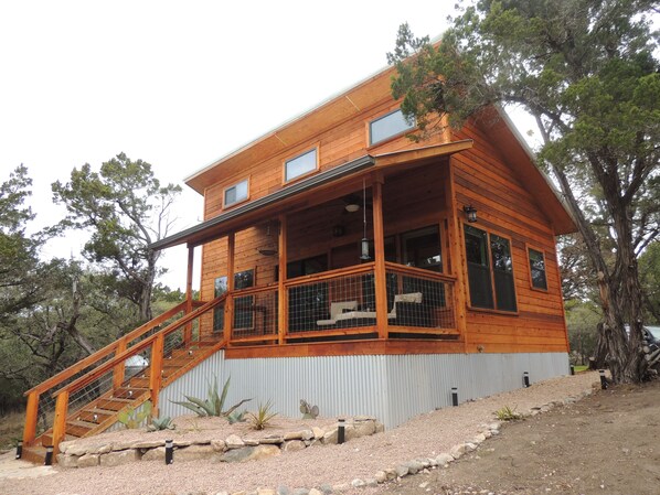 Cabin is 460 sq. ft. with a loft overlooking the waterfall. Creek flow varies.