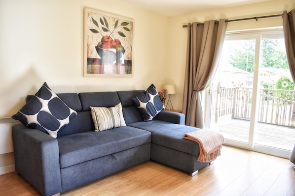 Spacious lounge area with double sofa bed.