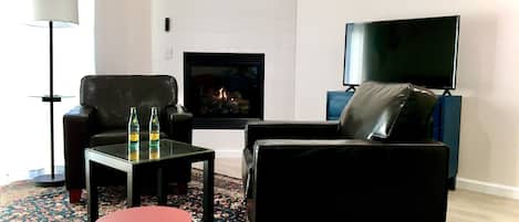 Relax in the vaulted living room with its gas fireplace at Cimarron Loft