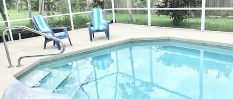 Gorgeous Heated Salt Water Pool Property with large screened in patio
