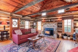 Living room with vaulted ceiling.