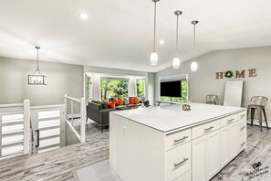 Bright, open-concept living space with a large kitchen island