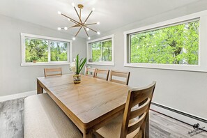 Bright dining room with a modern chandelier